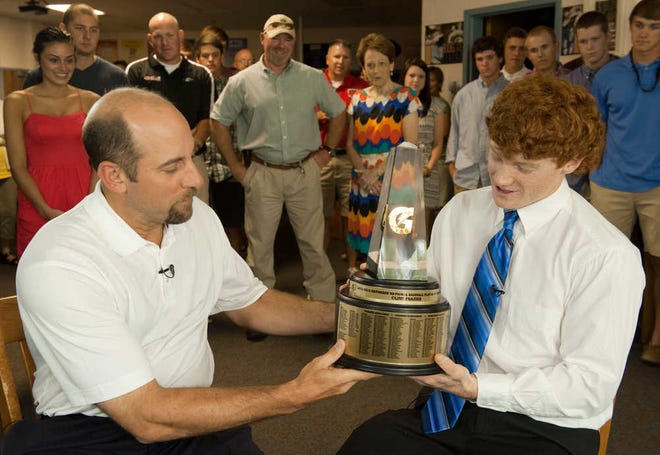 Clint Frazier of Loganville High School, right, is surprised with the 2012-13 Gatorade National Baseball Player of the Year trophy by eight-time MLB All-Star and current baseball analyst John Smoltz, Tuesday, June 4, 2013 in Loganville, Ga. (AP Photo/Gatorade, Susan Goldman) NO SALES