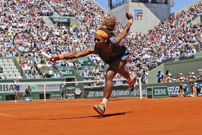 Michel Euler Associated Press Serena Williams reaches for the ball as she plays Russia's Svetlana Kuznetsova during their quarterfinal match.