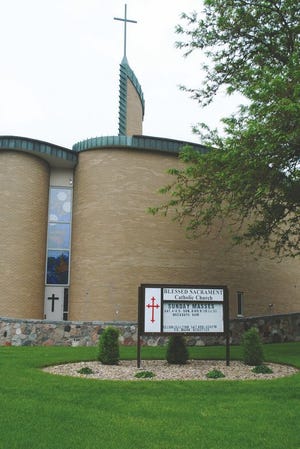 Blessed Sacrament recently celebrated paying off its loan used for expansions for the church and school with a note burning.