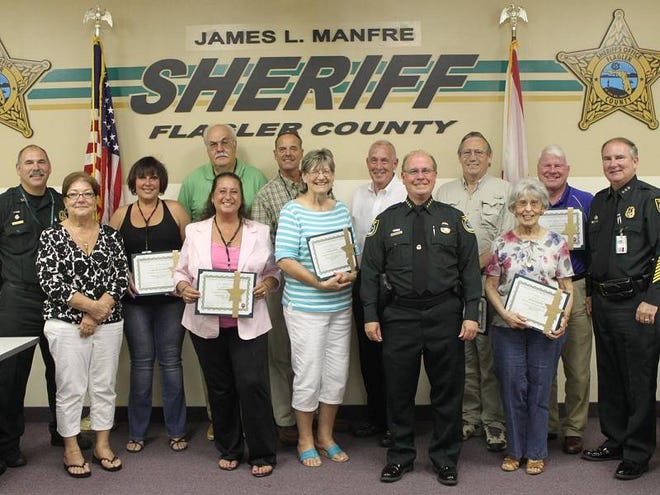Flagler County Sheriff James L. Manfre, front row, third from right, poses with the newest graduates of the Flagler Sheriffís Office Citizen Academy. Undersheriff Rick Staly is far right and Sgt. Mike Lutz, academy coordinator, is pictured left on the back row.
