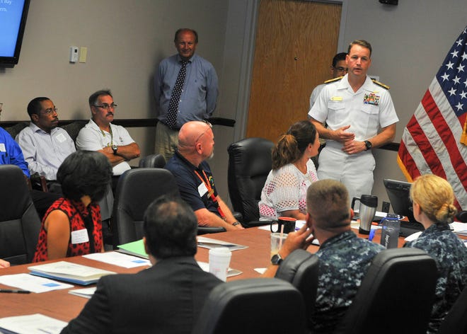 Rear Adm. John C. Scorby Jr., commander, Navy Region Southeast, makes the opening remarks a regional emergency response exercise on board Naval Air Station Jacksonville. The training, designed to test the region's ability to establish and sustain recovery support operations in the days and weeks following the landfall of a hurricane, included emergency response personnel from NAS Jacksonville, Naval Station Mayport and Naval Submarine Base Kings Bay.