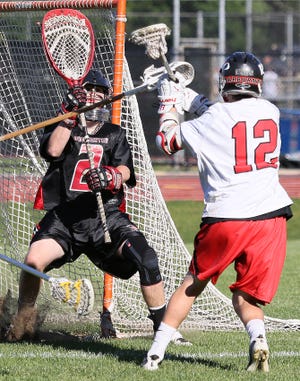 Hingham's David Freitas shoots during a tournament game against Winchester at Hingham High School on Tuesday, June 4, 2013.