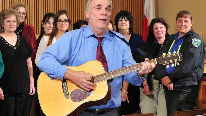 City Manager Jim Nuse performs at a recent employee event.