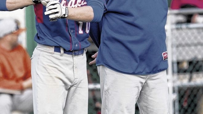Junior William Zwiener (10) gets some advice from head Coach Jeff Montgomery during the season. Montgomery will coach in the Austin Area All-Star Game Sunday at the Dell Diamond.