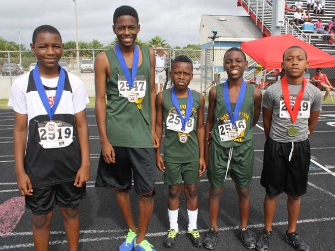 From left, Dangelo George, Isaiah Graham, Arden Marie, Tyrell Debose and Raziel Smith all receive medals for their age division.