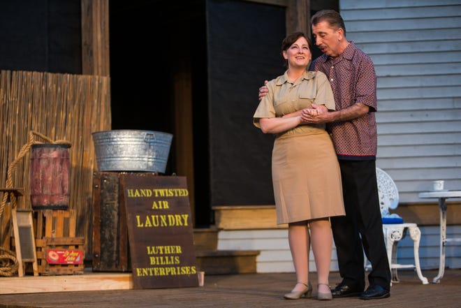 Becky Bertram, left, as Ensign Nellie Forbush, and Brad Barnes, right, as Emile de Becque, star in Theatre In The Park's "South Pacific" at Lincoln's New Salem State Historic Site.