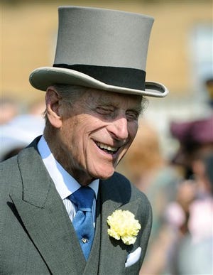 Prince Philip attends a garden party at Buckingham Palace in London Thursday. Buckingham Palace says Queen Elizabeth II's husband was later admitted to a London hospital for an exploratory operation. The palace said the operation on 91-year-old Prince Philip will come after "abdominal investigations," but did not elaborate.