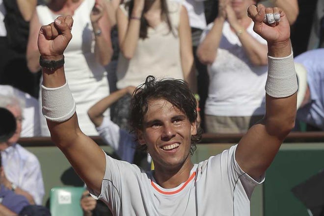 Michel Euler Associated Press Rafael Nadal celebrates after defeating Novak Djokovic in their semifinal match at the French Open at Roland Garros stadium in Paris on Friday.