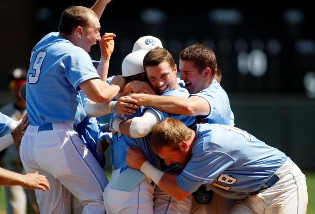 Freshman Skye Bolt is mobbed by his UNC teammates after his walk-off hit during Saturday's Super Regional game against South Carolina.