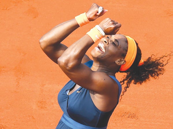 Serena Williams celebrates after defeating Maria Sharapova in the finals of the French Open on Saturday. (David Vincent | Associated Press)