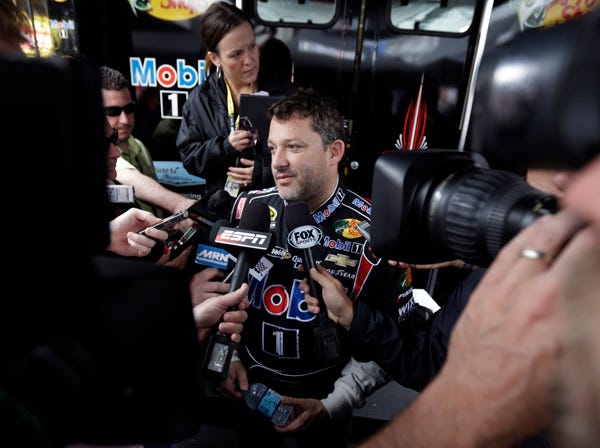 Driver Tony Stewart talks with the media Saturday during a break between practice sessions for Sunday's NASCAR Sprint Cup race in Long Pond, Pa. (Matt Slocum | Associated Press)