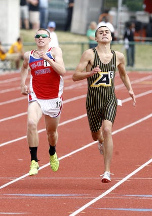 St. Thomas Aquinas's Cory Glines right places second to New Madison Tri-Village's Clayton Murphy in the Boy's 1600 Meter Divisiion III State Final.