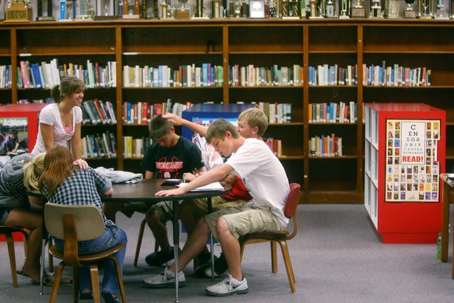 Students gather Wednesday in the library at Nokomis High School on during study hall. The school is in consolidation talks with Morrisonville and Panhandle.