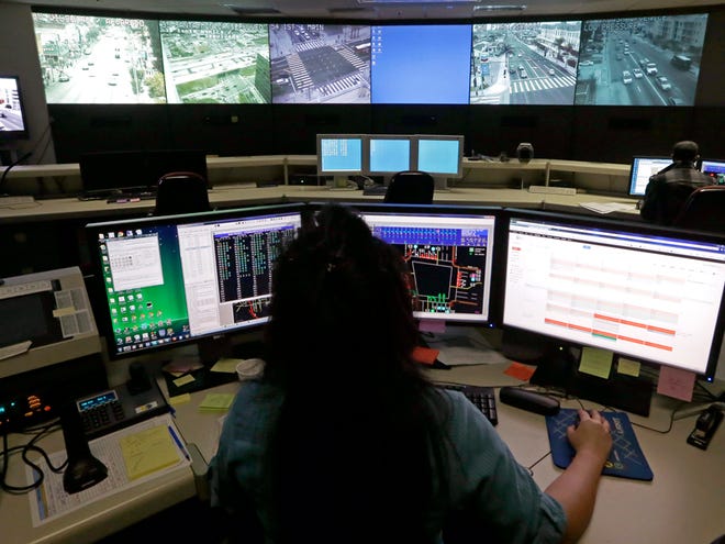 file | the associated press
Transportation engineer associate Abeer Kliefe works at the Los Angeles Department of Transportation’s Automated Traffic Surveillance and Control Center in downtown Los Angeles. In a 2011 poll, 54 percent of those surveyed felt protecting citizens’ freedoms should be a higher priority than keeping people safe from terrorists.