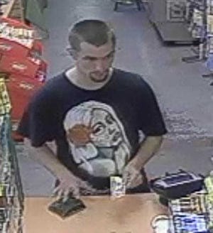 Columbia County authorities are trying to identify a man wanted for taking another man's wallet from a store counter on June 2.