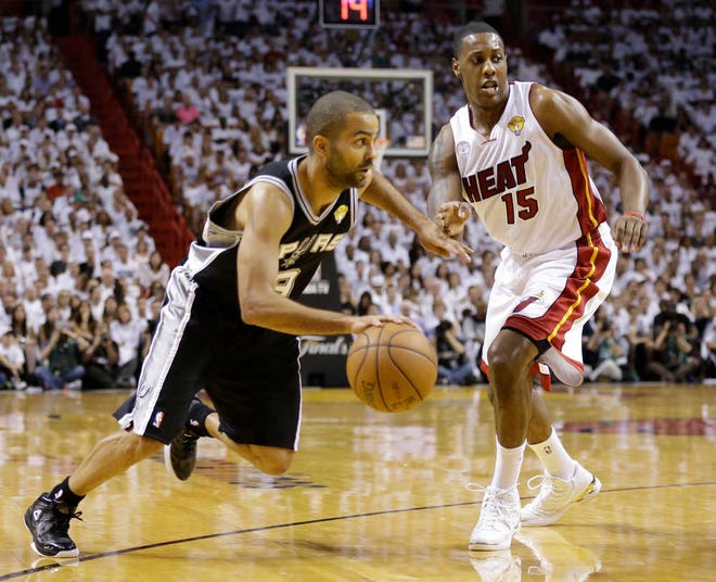 Spurs point guard Tony Parker drives to the basket past Miami's Mario Chalmers in Game 2. San Antonio took Game 1 but then was handed a 103-84 defeat.
