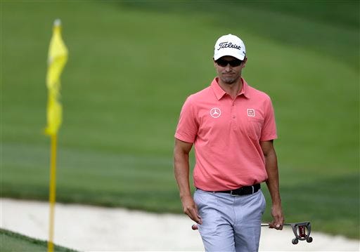 Adam Scott, of Australia, walks to his ball on the first hole during the final round of the Memorial golf tournament Sunday, June 2, 2013, in Dublin, Ohio. (AP Photo/Darron Cummings)