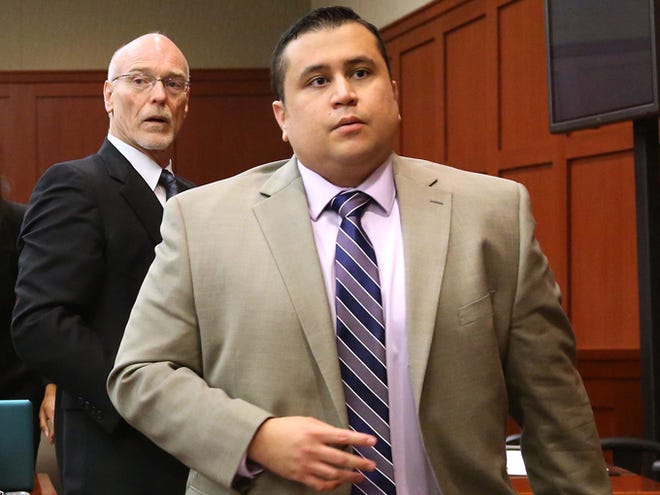 George Zimmerman, right, and attorney Don West, stand as the judge enters the courtroom in Seminole circuit court for a pretrial hearing Saturday in Sanford, Fla. Jury selection begins Monday in the second-degree murder trial, which is expected to last about six weeks.