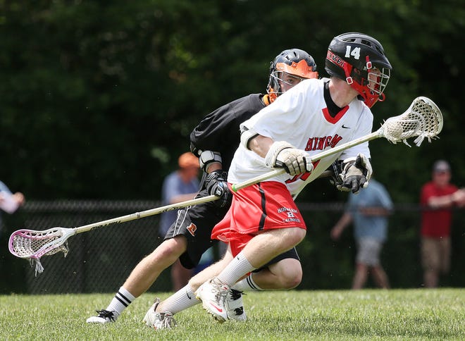 Beverly's Jack Atherton, left, keeps a close eye on Hingham's Patrick Burke during the Division 2 East lacrosse semifinal played at Hingham High School on Sunday, June 9, 2013.