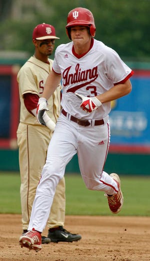 Indiana's Scott Donley passes by Florida State shortstop Giovanny Alfonzo after he hit a home run Sunday during the third inning of an NCAA super regional game.