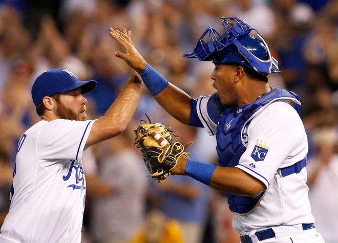 Kansas City catcher Salvador Perez, right, hit a two-run triple in the third inning and closer Greg Holland, left, pitched a scoreless ninth to help the Royals beat the Tigers 3-2 on Monday at Kauffman Stadium. The Royals are on a six-game winning streak, the longest since Sept. 2011.