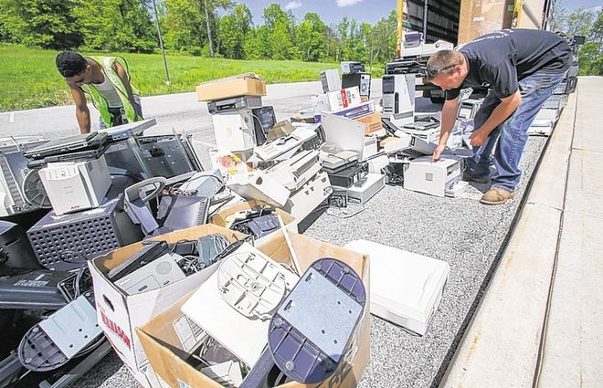 Jay DeGroat, left, of Matamoras, Pa., and Matt Kestler of Glen Spey sort through electronics to organize the loading of a truck. 

The Orange County Chamber of Commerce sponsored a two-day electronic recycling program last month. 

Advanced Recovery collected more than 20,000 pounds of electronics during the event.