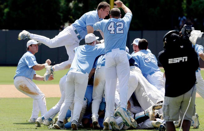 North Carolina players celebrate following their 5-4 win over South Carolina in Game 3.