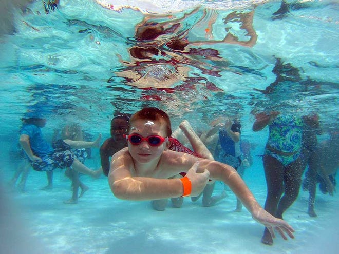 Kids from summer camps participate in the largest swimming lesson on record at the Frieda Zamba Swimming Pool in Palm Coast Thursday June 14 2012.
