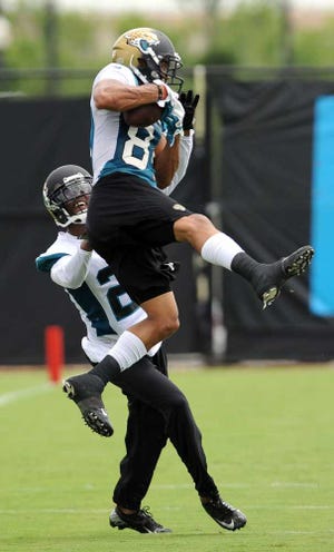 Bob.Mack@jacksonville.com Jaguars cornerback Alan Ball tries to cover receiver Cecil Shorts III during the first day of minicamp on Tuesday. Ball is expected to be a key player on the Jaguars' defense this season.