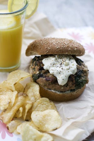 Greek-style turkey burger gets extra moisture and flavor from a yogurt-based pepperoncini sauce.