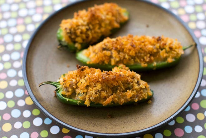 Cheesy sausage-stuffed jalapeno peppers are displayed in Concord, N.H.