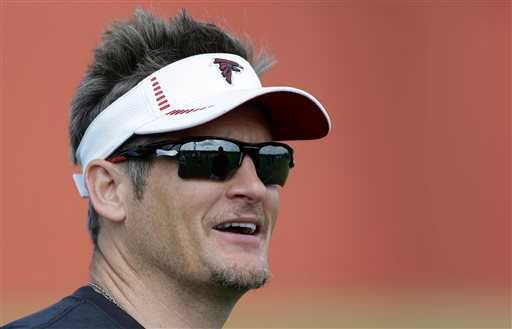 In this June 11, 2013 photo, Atlanta Falcons general manager Thomas Dimitroff looks on during an NFL football practice in Flowery Branch, Ga. Dimitroff said Wednesday, June 12, 2013, he believes the team is ?n a really good place right now?after adding free agent running back Steven Jackson and defensive end Osi Umenyiora. (AP Photo/John Bazemore)