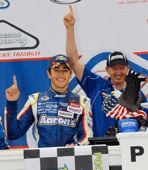 Chase Elliott (left) was joined in Victory Lane by his father, Bill Elliott, after Chase won Saturday's ARCA race at Pocono.