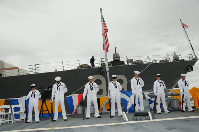 Naval Station Mayport's Honor Detail bow their heads during an invocation by Cmdr. Steve Souders at the Battle of Midway commemoration ceremony held aboard USS The Sullivans on June 5.