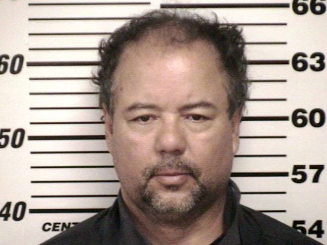 This undated file photo provided by the Cuyahoga County Jail shows Ariel Castro in Cleveland. The man accused of holding three women captive in his Cleveland home for about a decade pleaded not guilty Wednesday to hundreds of charges, including rape and kidnapping.