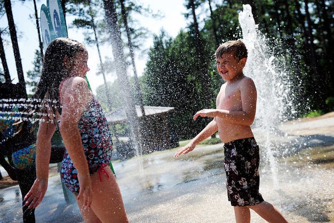 The splash pad at the playground behind the Columbia County Library in Evans offers children a fun chance to cool off on hot summer days, and it's free.