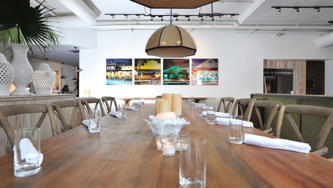 A communal table at Buccan. (Jeffrey Langlois/ Palm Beach Daily News)