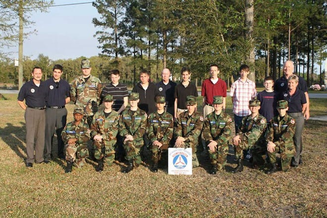 Photo courtesy of Jeff Lariscy The Effingham Cadet Squadron of the Civil Air Patrol (CAP) recently received donations from the Effingham County Board of Commissioners and SM Promotions of Rincon. The Board of Commissioners provided the squadron with a $90 donation that had been raised by participation of employees in "dress down" days. The squadron also received a sign from SM Promotions that is now marking the squadron's meeting location on the campus of Effingham Christian School. Civil Air Patrol is the United States Air Force Auxiliary, an organization staffed by volunteers throughout the United States. Three missions are pursued by all CAP members: aerospace education, cadet programs, and emergency services. The Effingham Cadet Squadron meets on Monday evenings from 6:30 p.m. to 8:30 p.m. in building 200 at Effingham Christian School on Goshen Road. Individuals interested in finding out more about CAP can visit the squadron website at http://www.ga453.org or contact Captain Richard Bush, squadron commander, at 912-429-8050.