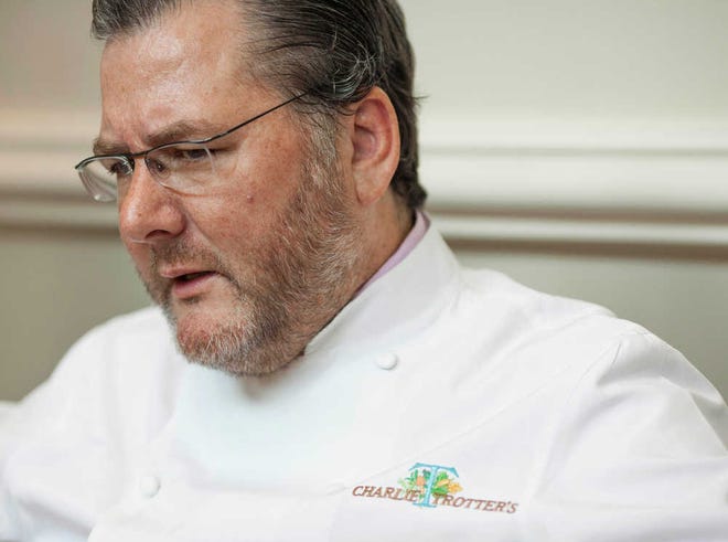 FILE - In this Aug. 28, 2012 file photo, award-winning chef Charlie Trotter is seen during an interview with The Associated Press at his restaurant in Chicago. A federal lawsuit filed Thursday, June 13, 2013, in Chicago accuses Trotter and one of his wine experts of duping two New York wine collectors into buying what they thought was a bottle of 1945 Domaine de la Romanee-Conti magnum in June 2012. They are seeking damages of more than $76,000. They accuse Trotter and his company of violating Illinois consumer fraud laws. (AP Photo/Sitthixay Ditthavong, File)
