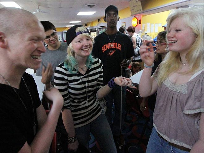 Participants in the Center for the Visually Impaired's Summer Teen Transition Program, from left, Manases Hernandey, 18, Rico Perez, 15, Aaliyah Gisondi, 15, Kevin Breathwaite, 20, and Megan Dartley, 16, share a laugh as they get ready to bowl at Bellair Lanes in Daytona Beach on Friday, June 14, 2013.