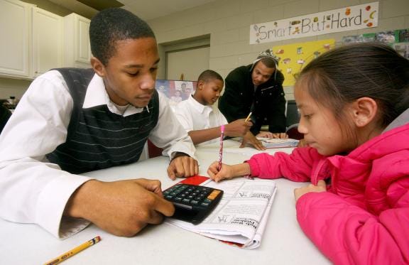 Davante Falls helps Maria Ibarra with math homework at the Boys and Girls Club in Shelby in 2011. The Boys and Girls Club hopes to partner with Cleveland County Schools to create a teen center at Turning Point Academy. (Star file photo)