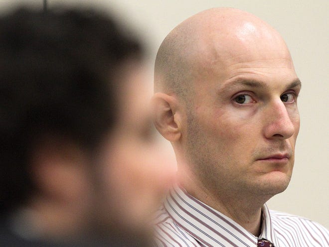 FILE PHOTO - Josh Fulgham listens to one of his defense attorneys while questioning a possible juror in April 2012.