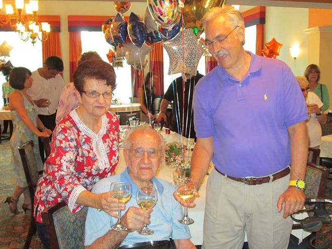 Vito Mallozzi (center) with his daughter Loretta Byrne and son George Mallozzi celebrating his 100th Birthday last year at The Windsor of Palm Coast. Vito Mallozzi will turn 101 on June 19 and is looking forward to this year's party.