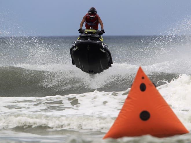 Eric Lagopoulos winner of the AquaX 1 jet ski race event, gets some air as he heads for the turn 3 buoy in Daytona Beach on Saturday