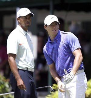 Darron Cummings Associated Press Tiger Woods (left) and Rory McIlroy struggled on Saturday.