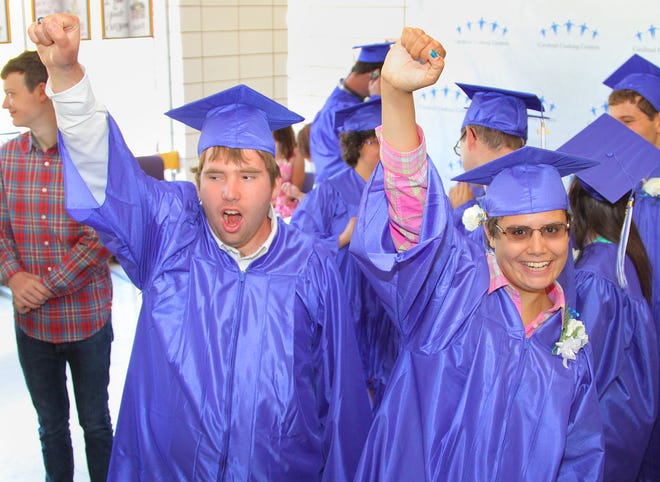 Henry Buxton and Ashley Chase celebrate at the Cardinal Cushing Centers graduation in Hanover on Saturday, June 15, 2013.