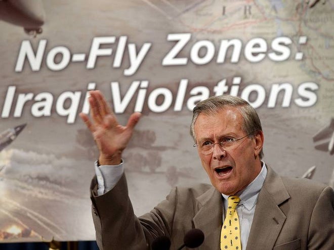 In this Sept. 30, 2002, file photo Defense Secretary Donald H. Rumsfeld speaks at a Pentagon news conference to criticize Iraq for continuing to fire on U.S. and British warplanes patrolling over two no-fly zones. Ten years after the 1992 establishment of the first no-fly zone over Iraq, and despite daily U.S. jet flights to enforce it, the U.S. did not prevent then-dictator Saddam Hussein, a Sunni Muslim, from persecuting and killing hundreds of thousands of Shiites whom he viewed as a political threat to his regime. That failure is now being used as a case in point of why the U.S. should, or shouldn't, police Syria's skies to prevent Syrian President Bashar Assad from accelerating a two-year death toll that last week reached 93,000.