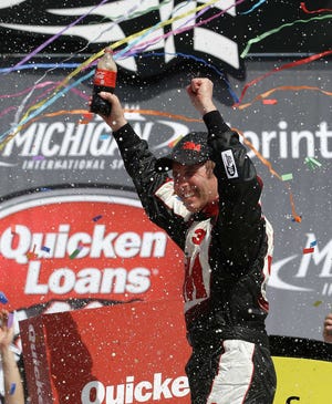 Greg Biffle celebrates his Quicken Loans 400 victory Sunday at Michigan International Speedway.