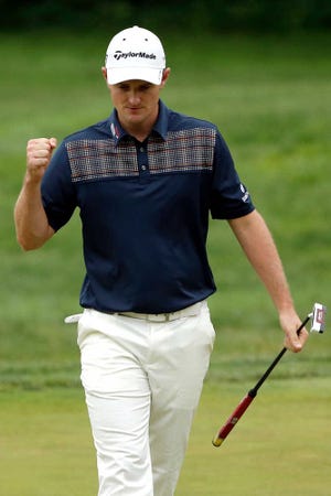 Justin Rose reacts after a birdie putt on the sixth hole Sunday during the fourth round of the U.S. Open at Merion Golf Club.