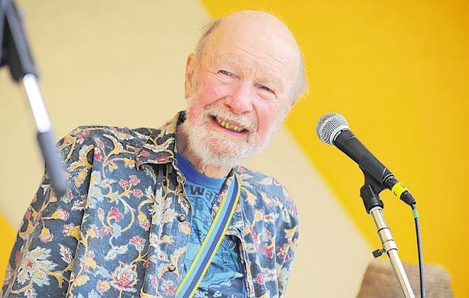 Music legend and mid-Hudson resident Pete Seeger performs for a large crowd Sunday during the Clearwater's Great Hudson River Revival weekend at Croton Point Park in Croton-on-Hudson. Seeger was joined onstage by Lorre Wyatt.
